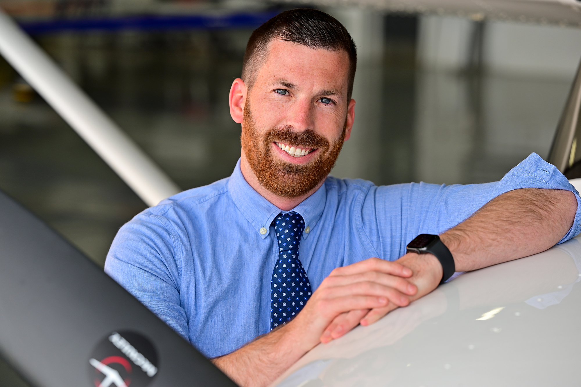 AOPA Medical Certificate Specialist Cade Halle poses for a photo at Frederick Municipal Airport in Frederick, Maryland, May 4, 2022. Photo by David Tulis.